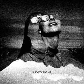 B/W cover of Levitations "Dust" LP showing a women's face with sunglasses, smiling to the sun.