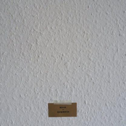 Cover of the kirre. "Dysphorie" EP showing a small piece of cardboard holding the band name and album title. It's taped to a wall with ingrain wallpaper.