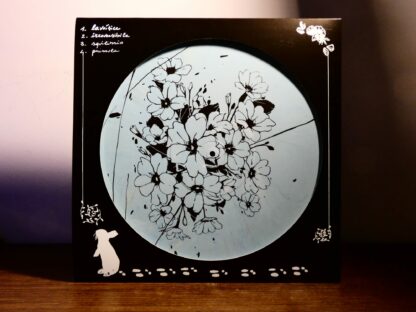 Photo of the Chivàla "II" EP B-Side Screen Print showing a bunch of flowers. Black print on white blue marbled vinyl.