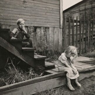 Cover of the Love American "Hollow Crosses" 7" showing a b/w picture of two children sitting in front of a house. One of them sits on the stairs looking skeptical, the other one crying on the floor.